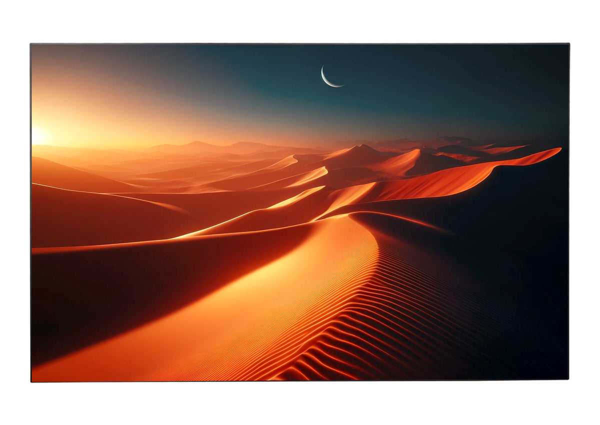 Front view of the celexon HomeCinema UST high contrast framed screen BrightOnyx with a projection of a vast desert landscape with gently rolling, red-golden sand dunes bathed in the warm light of the setting sun, above which a slender moon hangs in a deep blue sky.