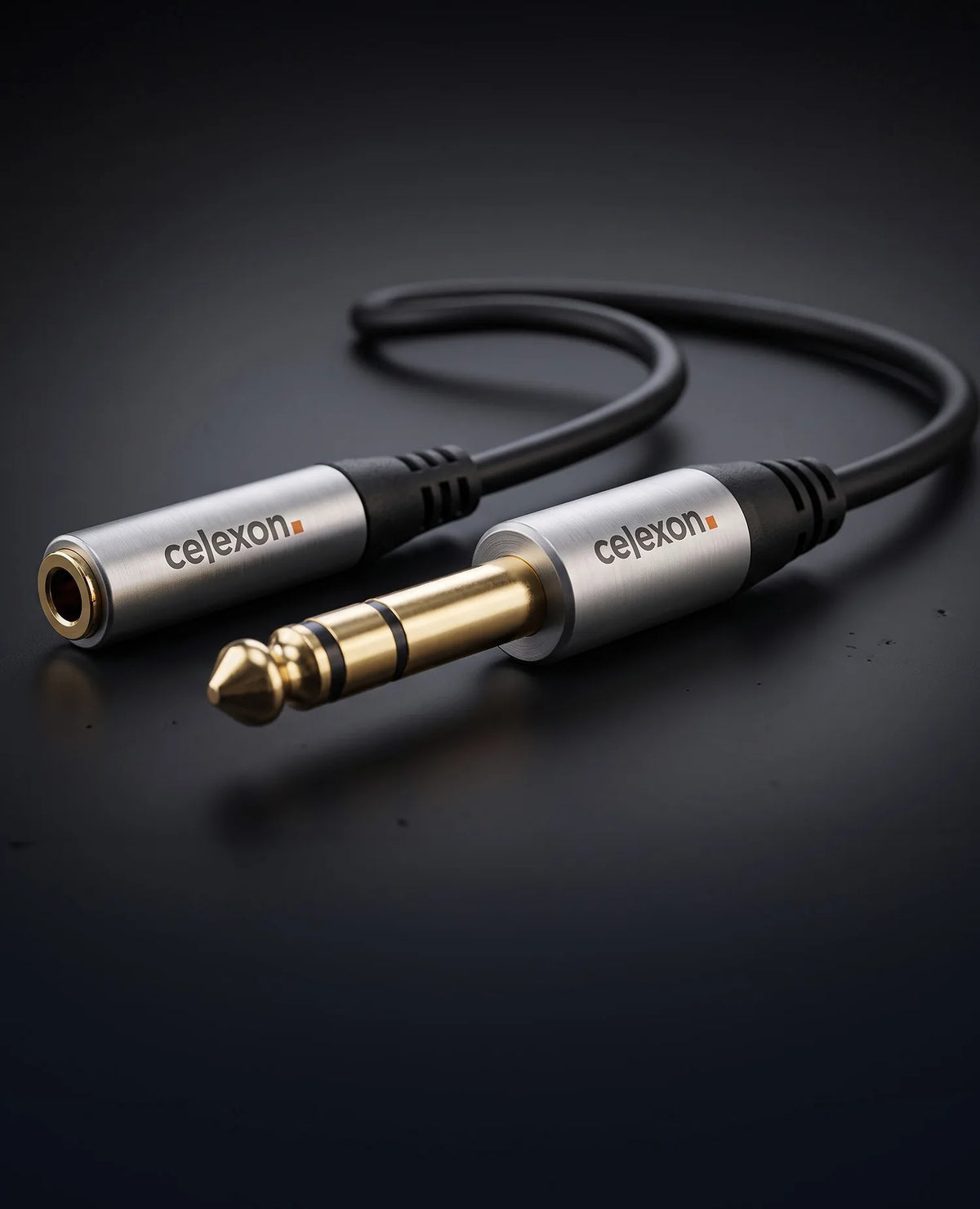 celexon 6.3mm stereo jack to 3.5mm stereo jack M/F audio adapter 0.25m - Professional Line in front of a dark background
