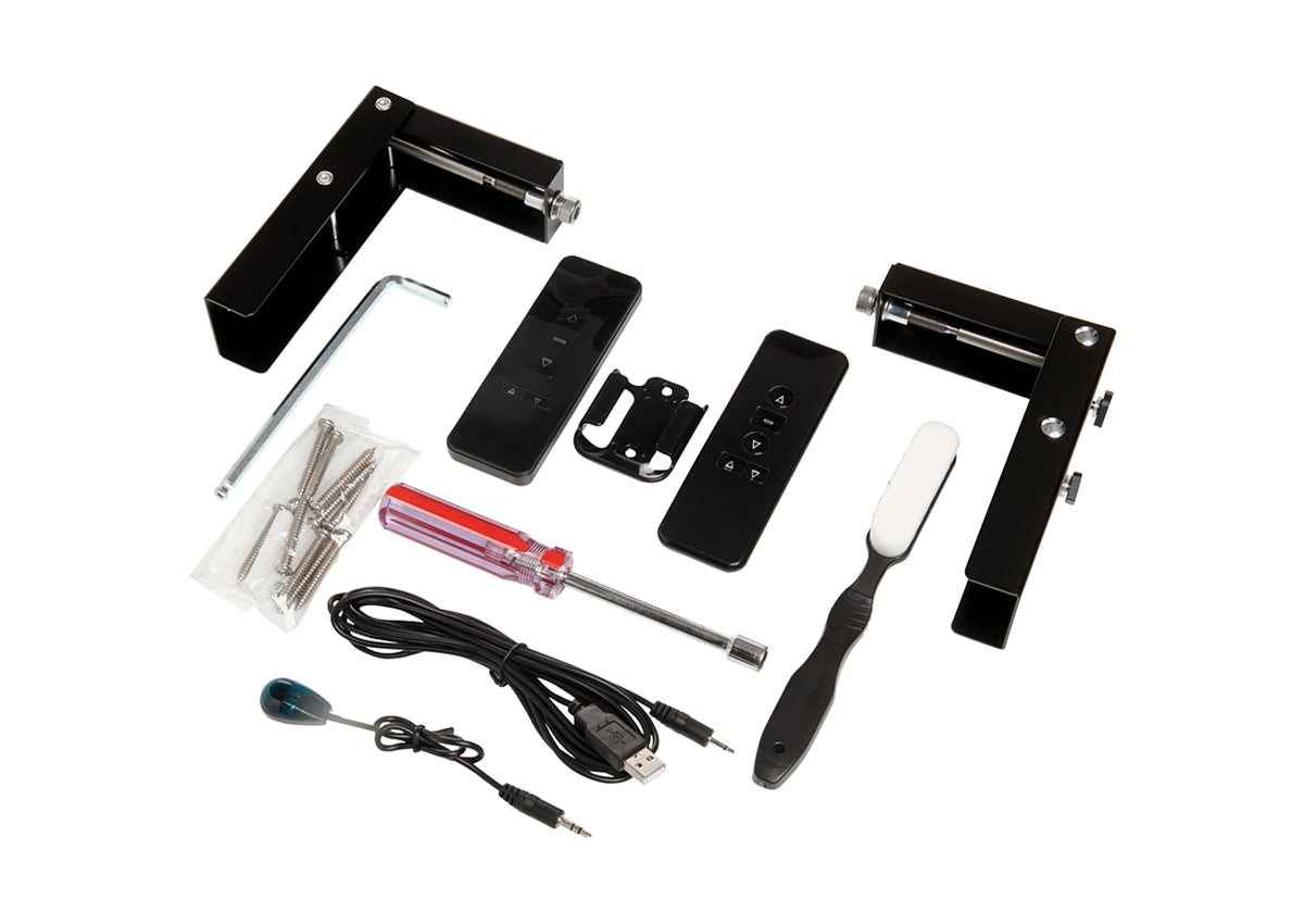Scope of delivery of the celexon HomeCinema V2.0 floor-rising scissor screen in black: cables, remote controls, mounting brackets and plates, screws and nuts, user manual, cleaning brush, and installation tool.