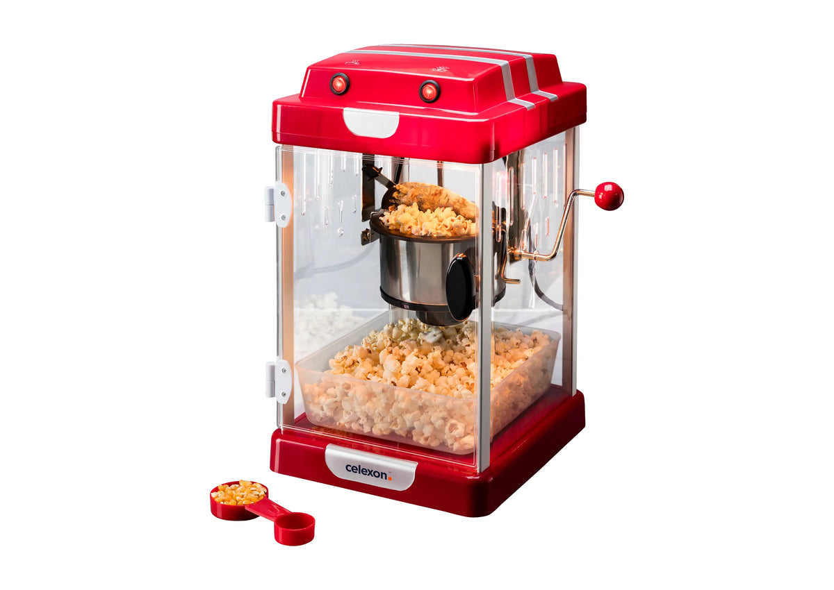 Frontal leicht angeschrägte Ansicht der celexon CinePopCP1000 Popcornmaschine mit Popcorn