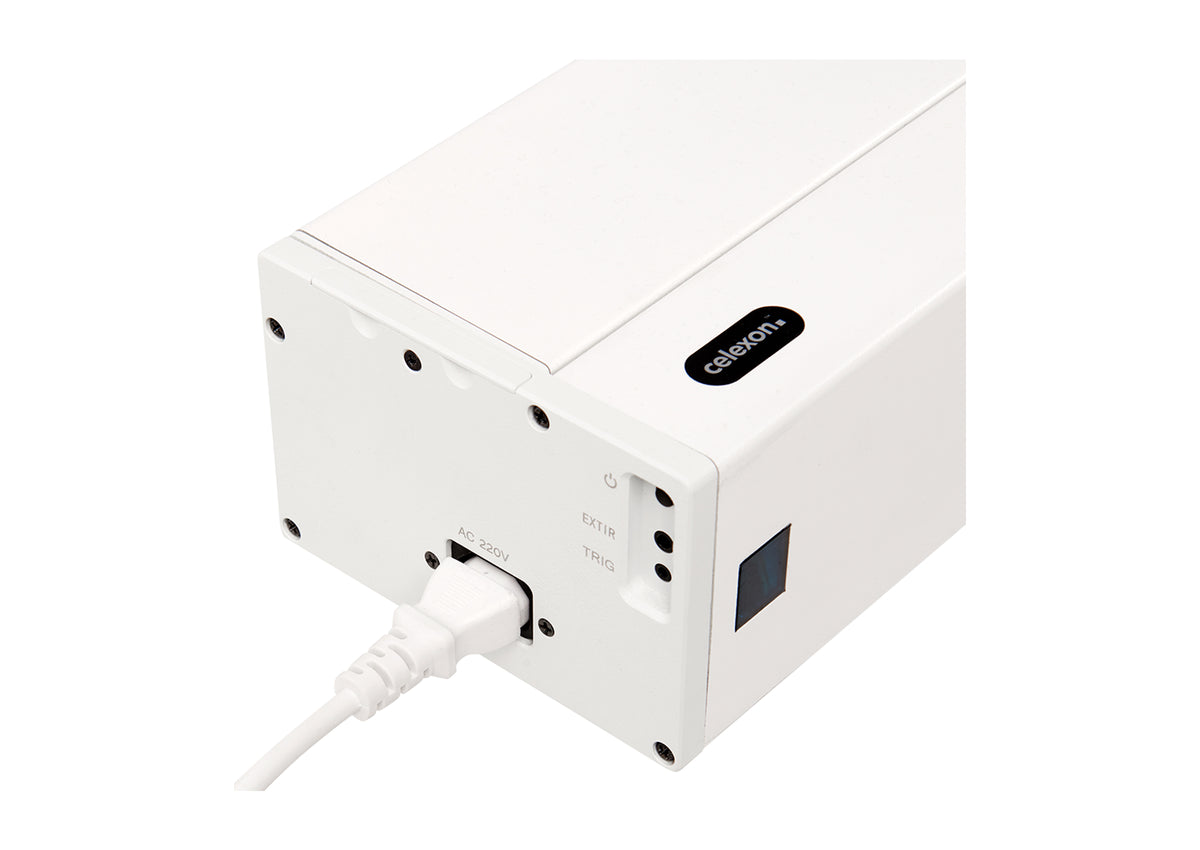 Close-up of the left side view of the celexon HomeCinema Plus floor-rising scissor screen in white. Power connection, control buttons, IR, and trigger ports are visible.