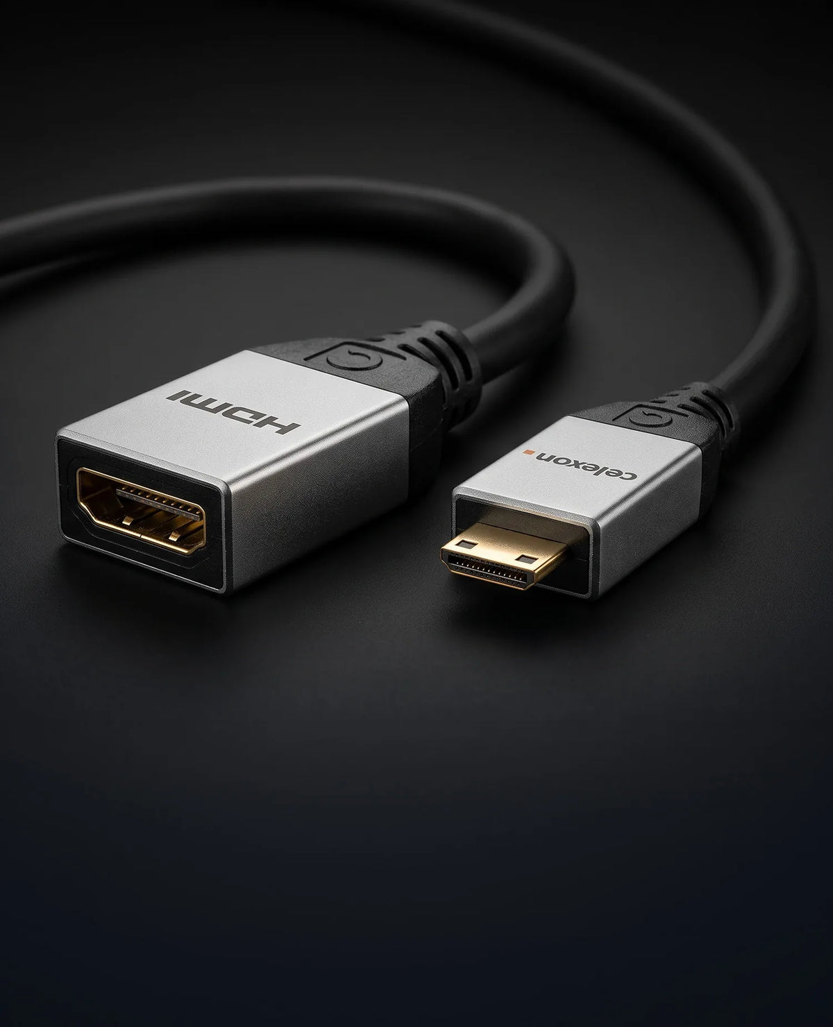celexon Mini HDMI to HDMI M/F Adapter with Ethernet - 2.0a/b 4K 0.25m - Professional Line in front of a dark background