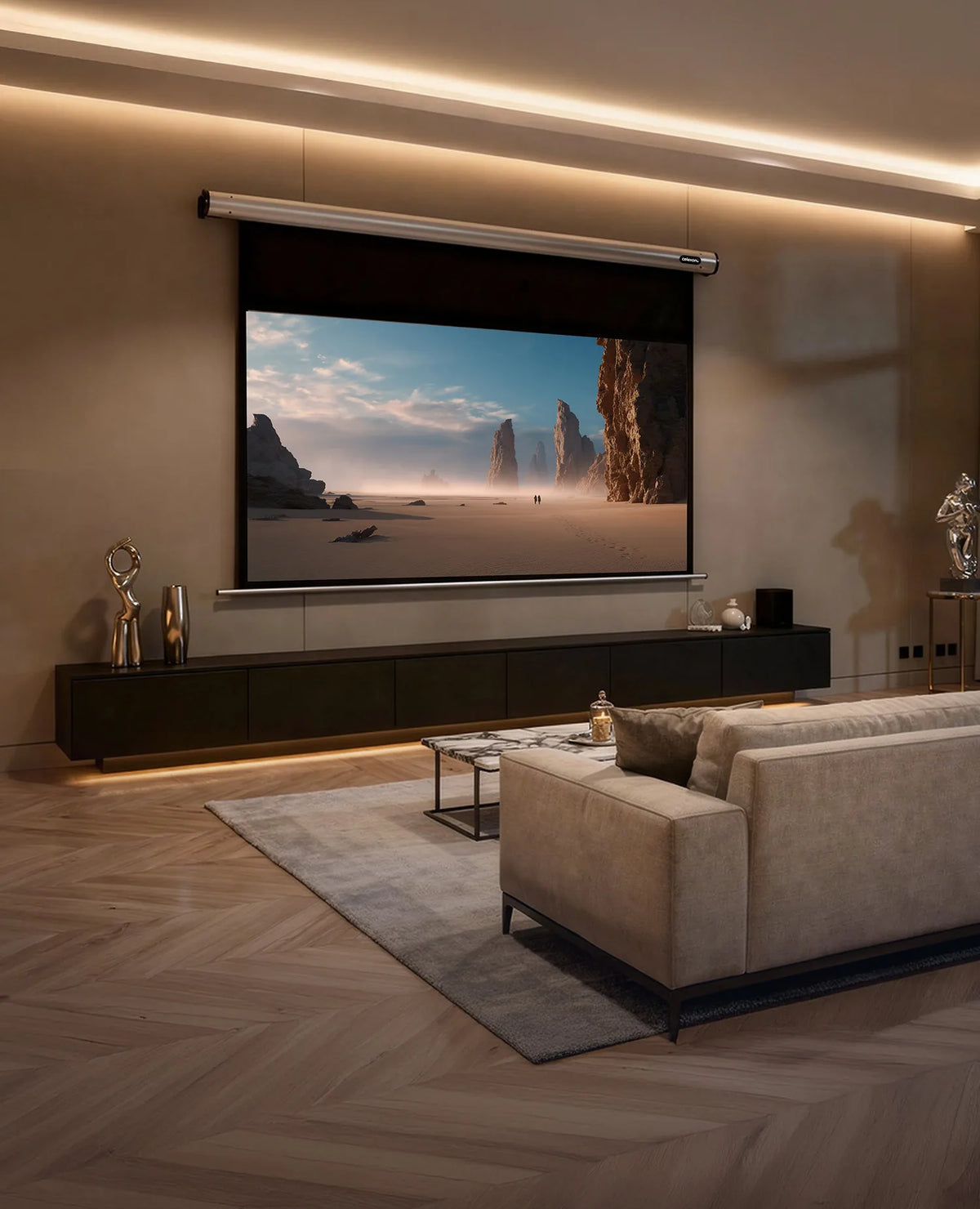 The image shows a modern, darkened living room with a celexon Projector Screen Electric HomeCinema, displaying a calm desert landscape, complemented by stylish furniture and indirect lighting.