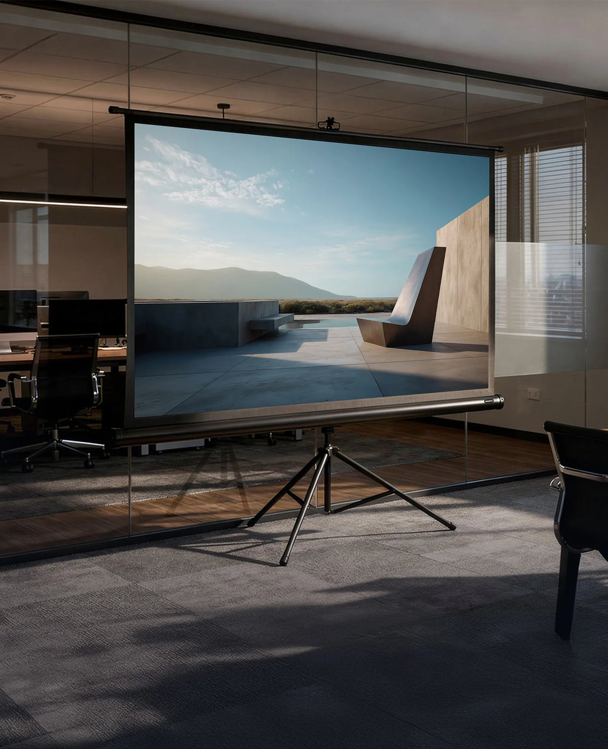 The image shows a modern conference and presentation room in an office building. In the foreground stands a celexon Tripod Economy projector screen, displaying a minimalist architectural scene.