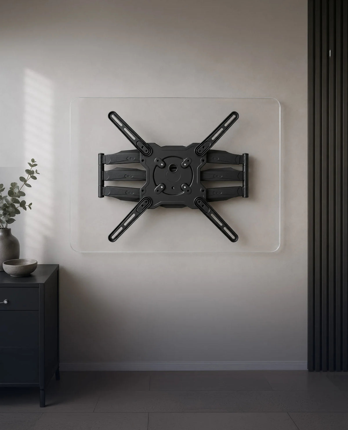 A minimalist product presentation of a TV wall mount positioned beneath a transparent acrylic panel with rounded corners. Front view with the central VESA mounting interface and the entire wall mount fully visible. A bright, modern wall, subtle home accessories, and soft natural daylight create a premium living atmosphere with a clear focus on the product.